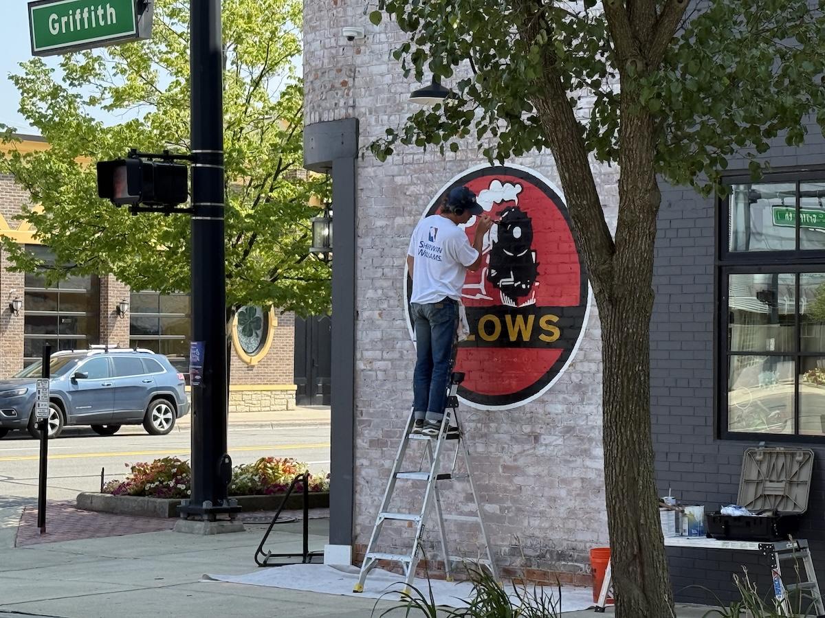 Slows Bar BQ sign being painted